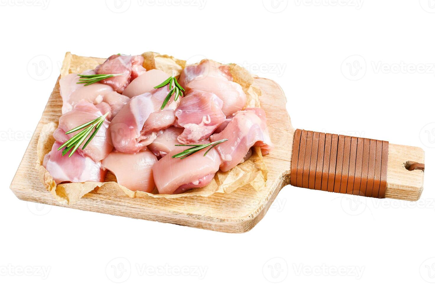 raw chicken fillet cut into cubes with spices. Isolated on white background. Top view. photo