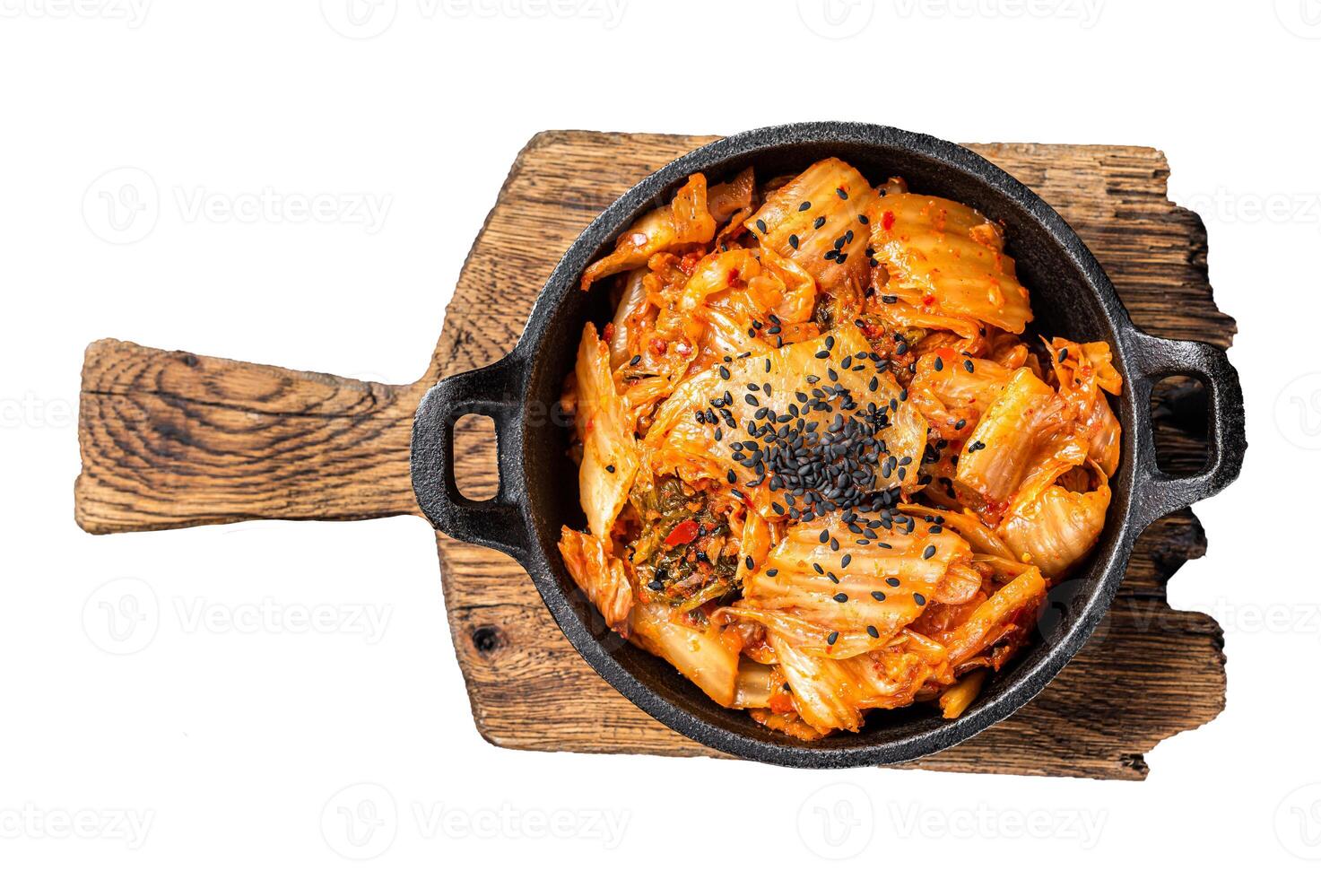 Kimchi salted and fermented chinese cabbage in a skillet. Isolated, white background. photo
