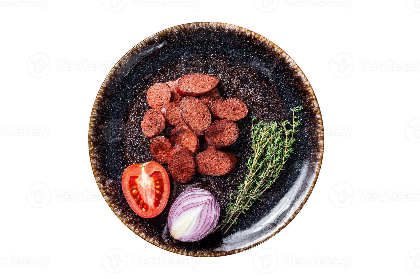 Fried sausage sucuk from beef meat on a plate with herbs. Isolated, white background. Top view. photo