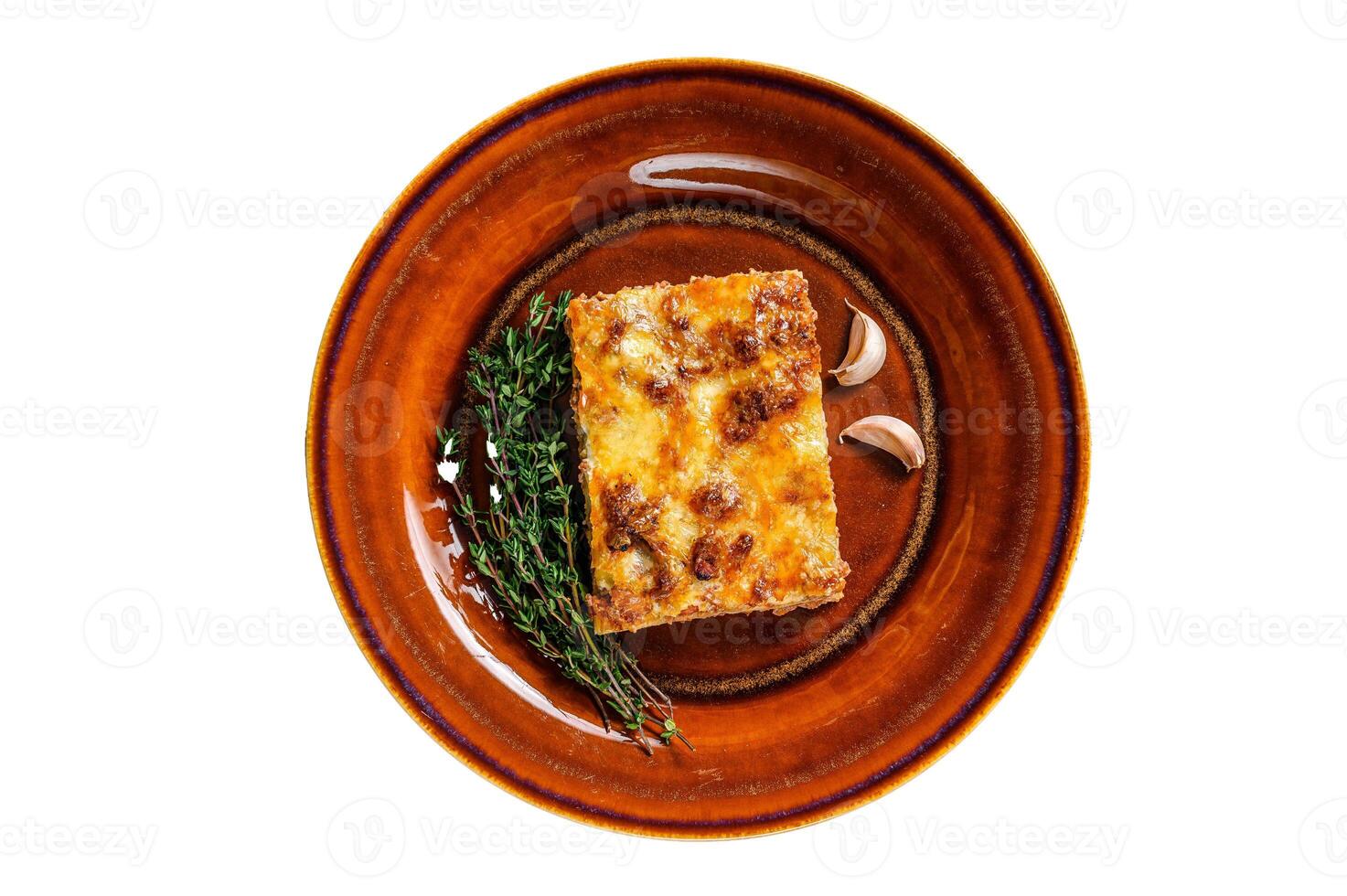 Italian Lasagne with tomato bolognese sauce and mince beef meat on a rustic plate. Isolated on white background. photo