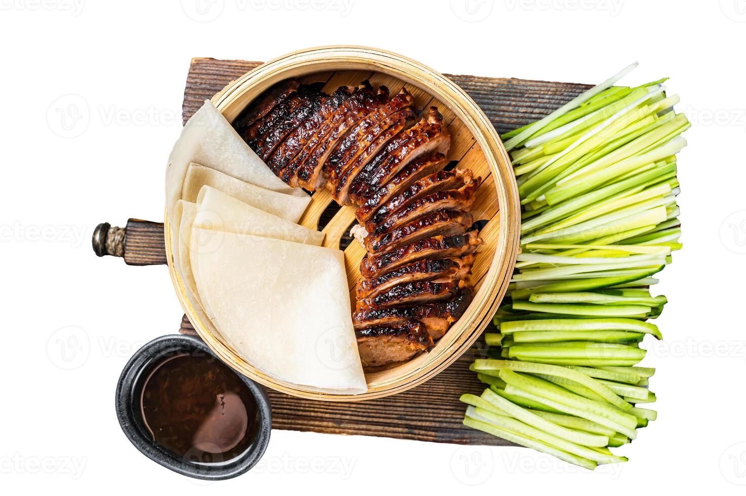 Peking Duck in bamboo steamer served with cucumber, green onion, and wheaten chinese pancakes and sauce Hoysin. Isolated, white background. photo
