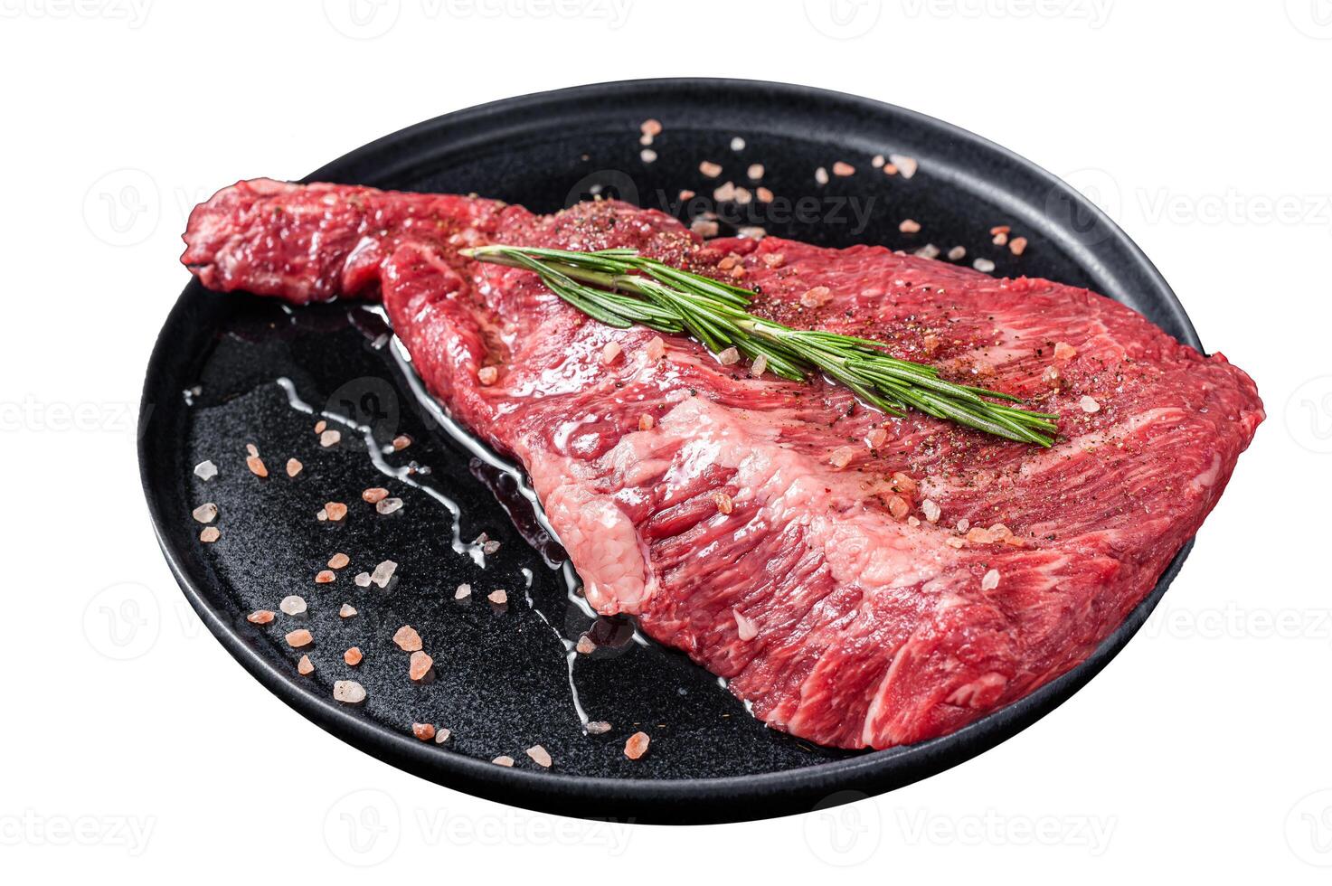 Seasoned raw tri-tip beef meat steak on plate. Isolated on white background. Top view. photo