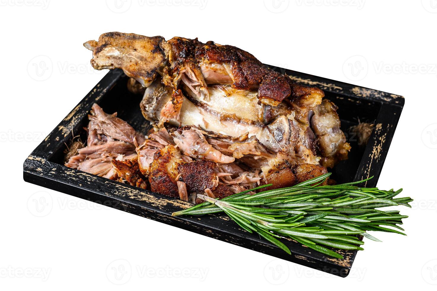 Roasted pork knuckle eisbein meat in a wooden tray with knife. Isolated on white background. Top view. photo