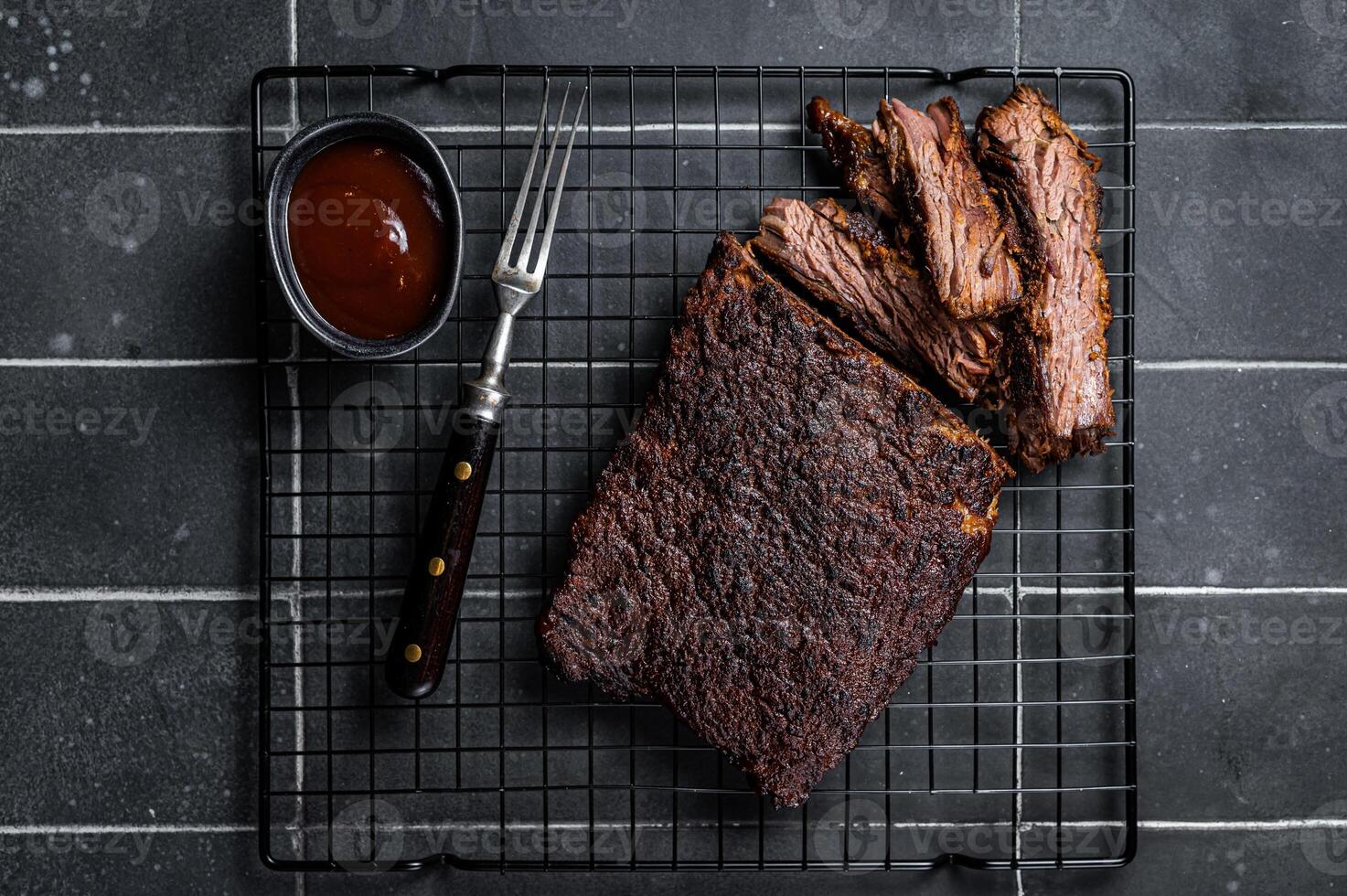 Chopped Beef Brisket barbecue, Traditional meat rubbed with spices and smoked in a Texas smoker. Black background. Top view photo