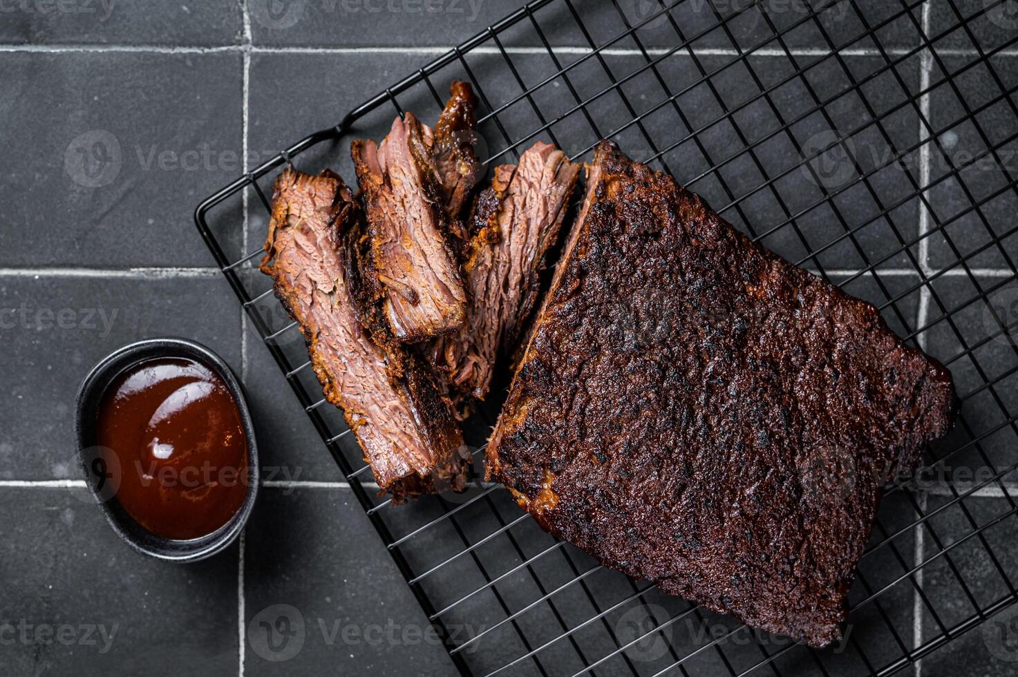 Chopped Beef Brisket barbecue, Traditional meat rubbed with spices and smoked in a Texas smoker. Black background. Top view photo