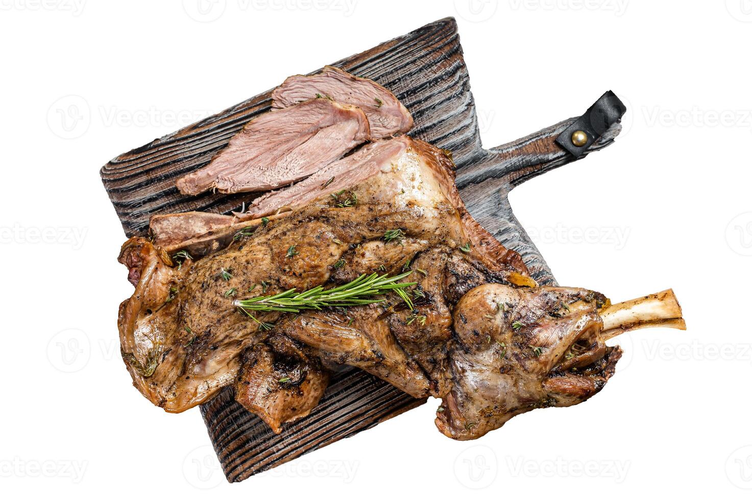 Slow Cooked grilled lamb mutton shoulder meat with herbs and spices on wooden board. Isolated, white background. photo