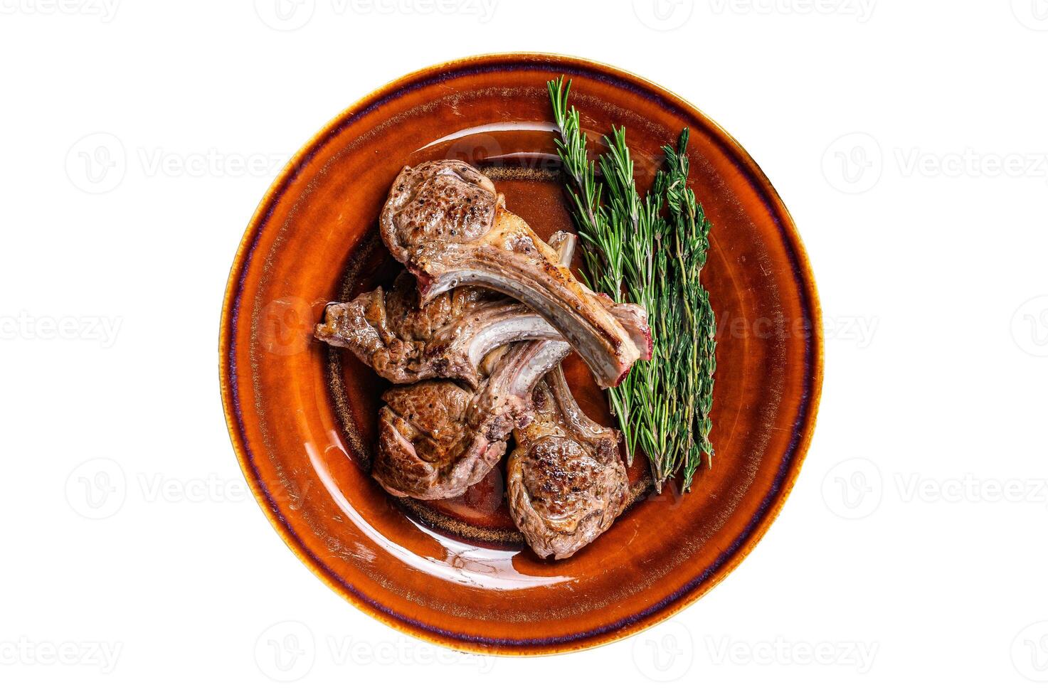 BBQ grilled lamb mutton meat chops steaks on a plate. Isolated on white background. photo