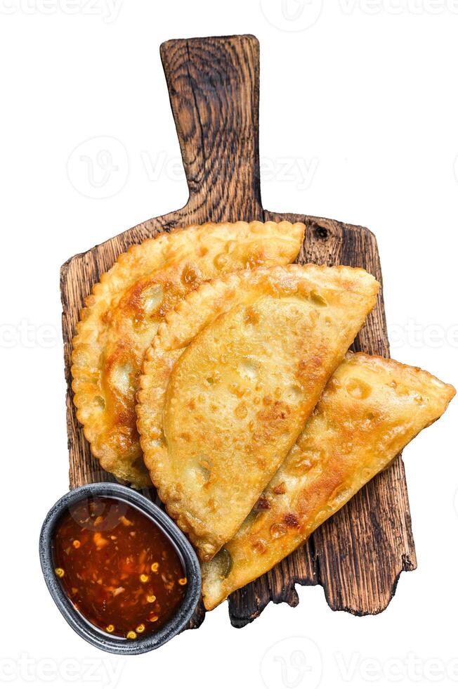 Mexican chilean food fried empanadas pie with beef meat. Isolated on white background, top view. photo