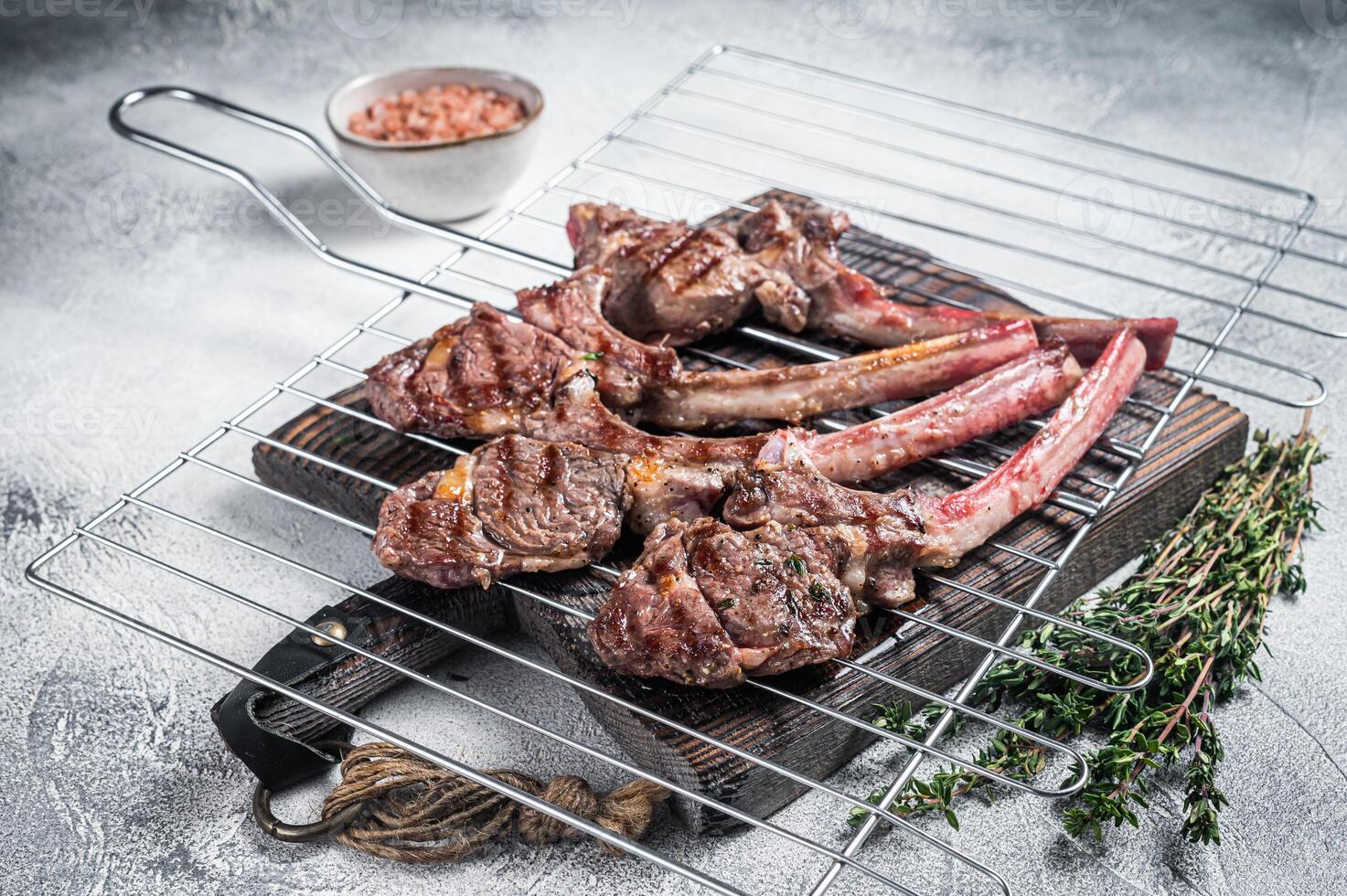 Barbecue grilled lamb meat chop on a grill, mutton rib cutlet. White background. Top view photo