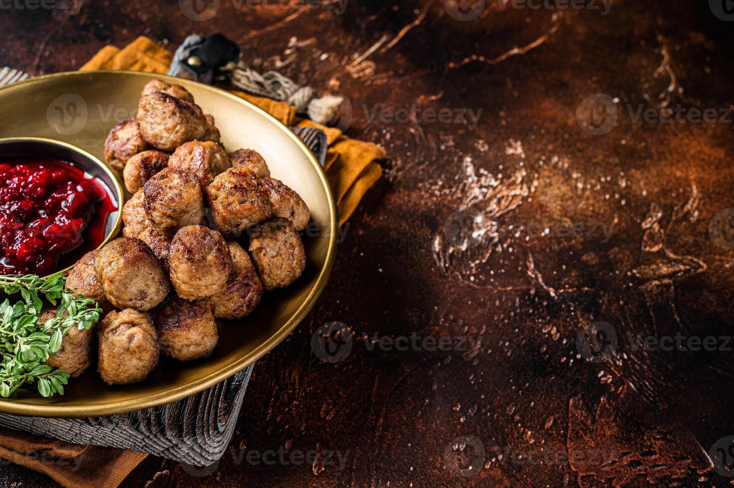 Beef meatballs with lingonberries jam, swedish meatballs. Dark background. Top view. Copy space photo
