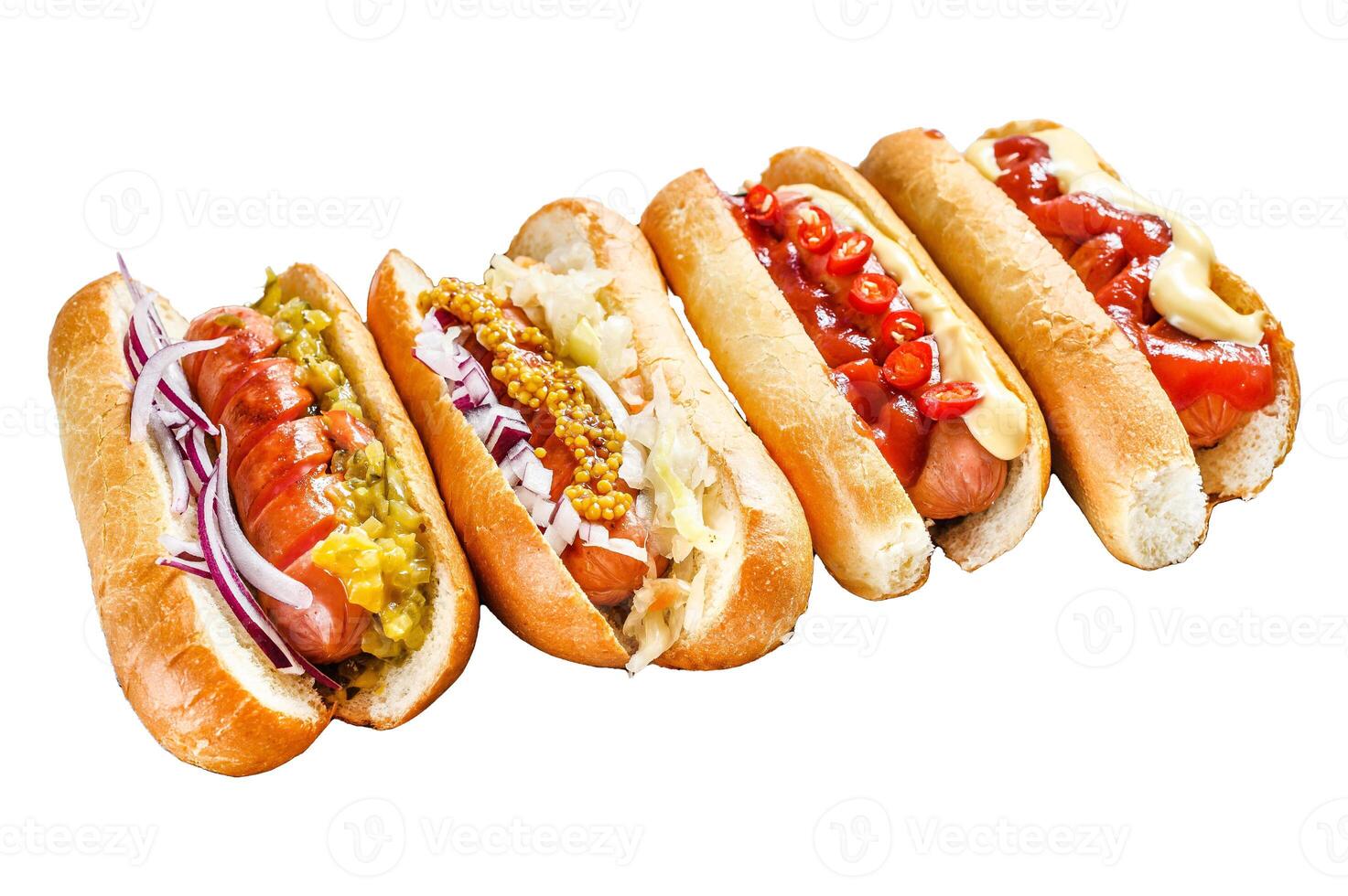 Hot dogs fully loaded with assorted toppings on a tray. Delicious hot-dogs with pork and beef sausages. Isolated on white background. Top view. photo