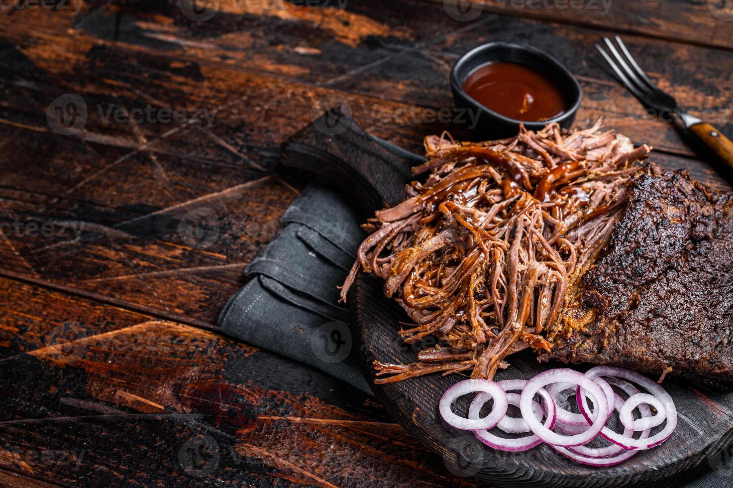 Traditional barbecue wagyu pulled beef on wooden board. Wooden background. Top view. Copy space photo