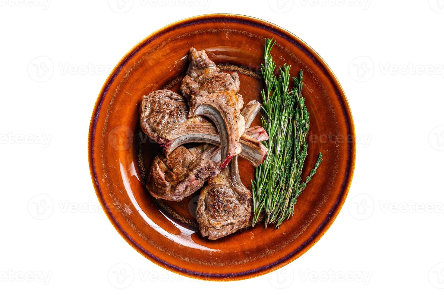 BBQ grilled lamb mutton meat chops steaks on a plate. Isolated, white background. Top view. photo