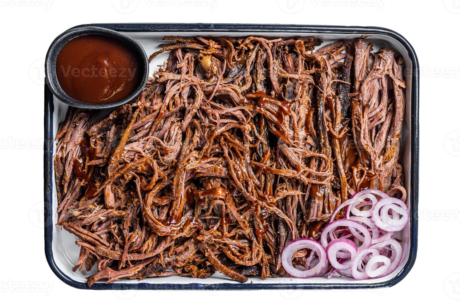 Pulled beef meat with hot chili sauce in baking dish. Isolated on white background. photo