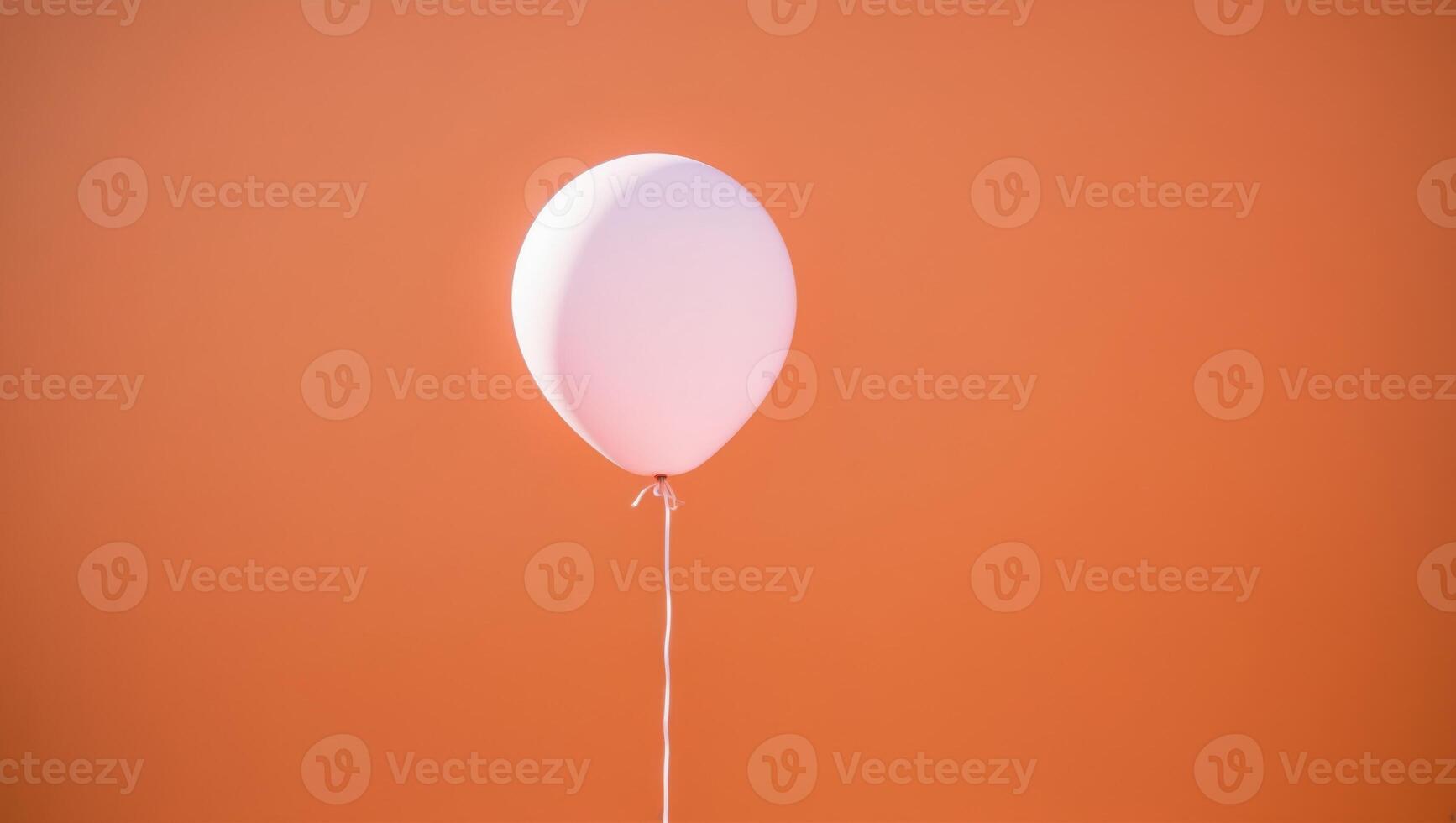 pink balloon flying on an orange background. photo