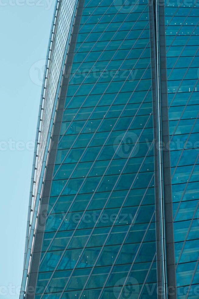 The Modern Architectural Design of a Skyscraper Features an Impressive Glass Facade photo