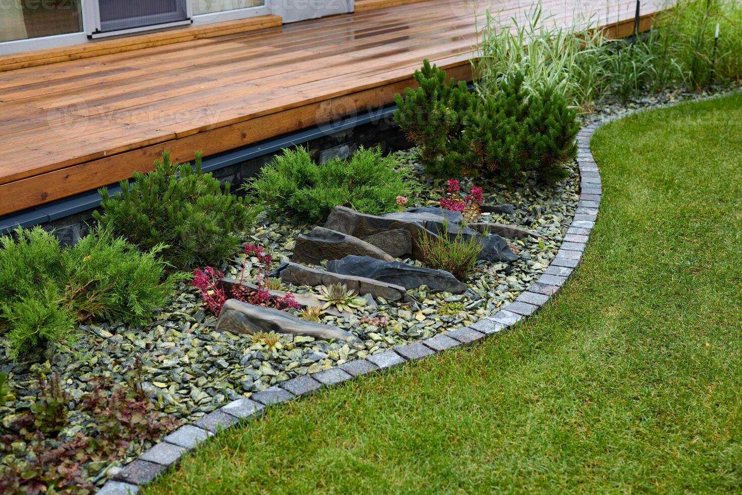 Beautiful Garden Landscape Featuring Elegant Stone Features and Colorful Floral Accents photo