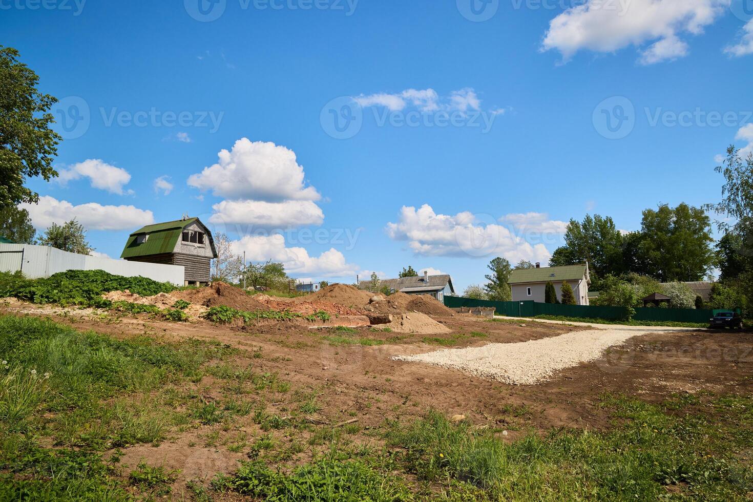 A picturesque rural landscape featuring a clear blue sky along with a construction site photo