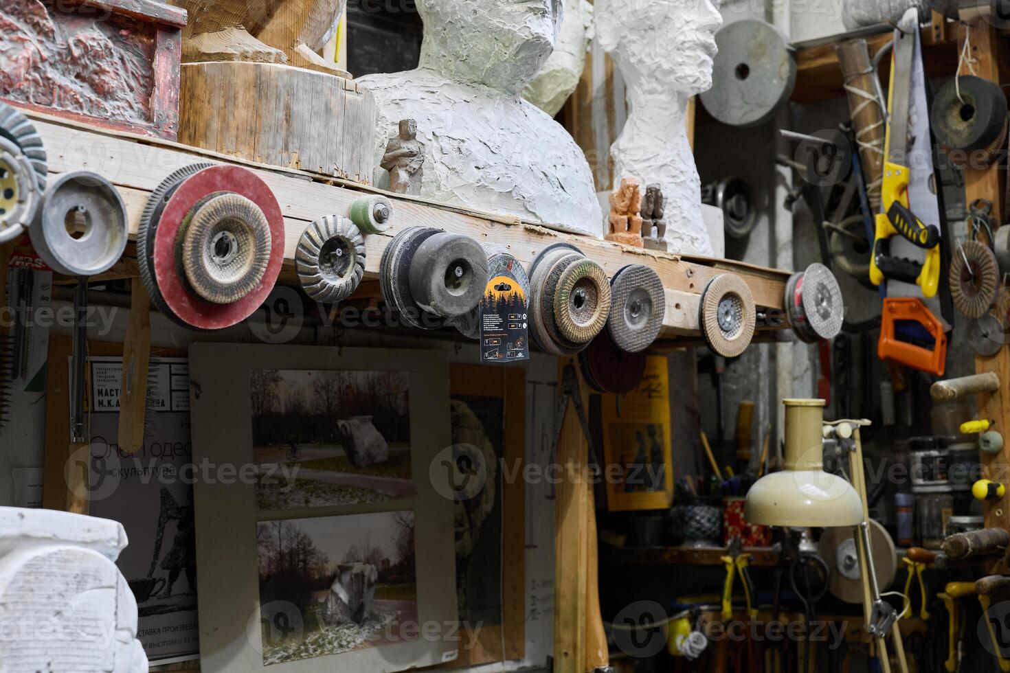 Artisan Workshop featuring Various Tools and Intriguing Sculptures and Artistic Creations photo