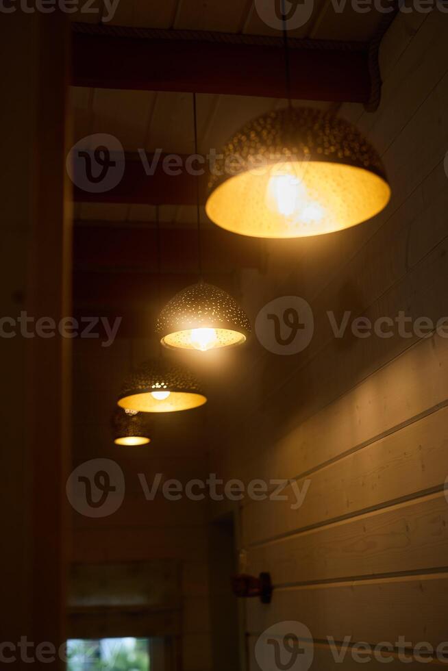 The Warm Pendant Lighting Creates an Inviting and Cozy Atmosphere in a Beautiful Interior Space photo