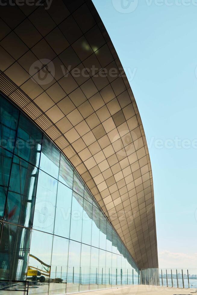 The Modern Architectural Design of a Curved Building Facade showcases innovative aesthetics photo