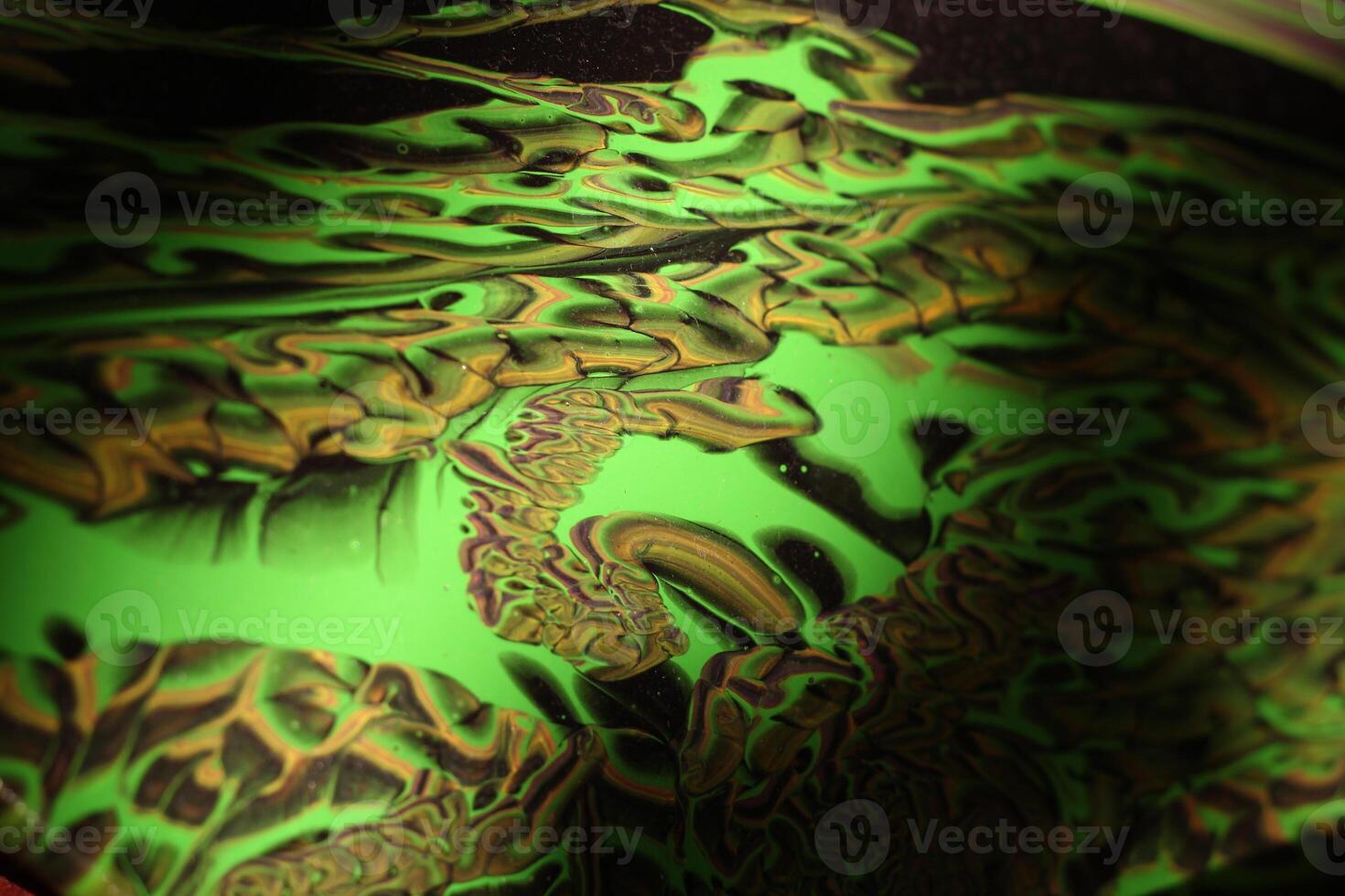 Experience the mesmerizing beauty of abstract green patterns created through fluid dynamics photo