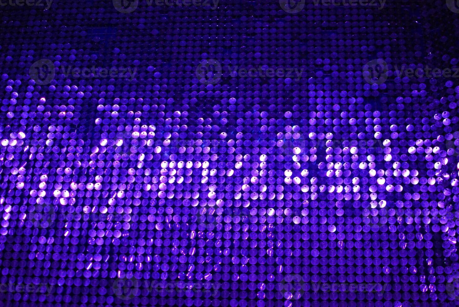 This vibrant purple sequins background is perfect for enhancing all your creative projects photo