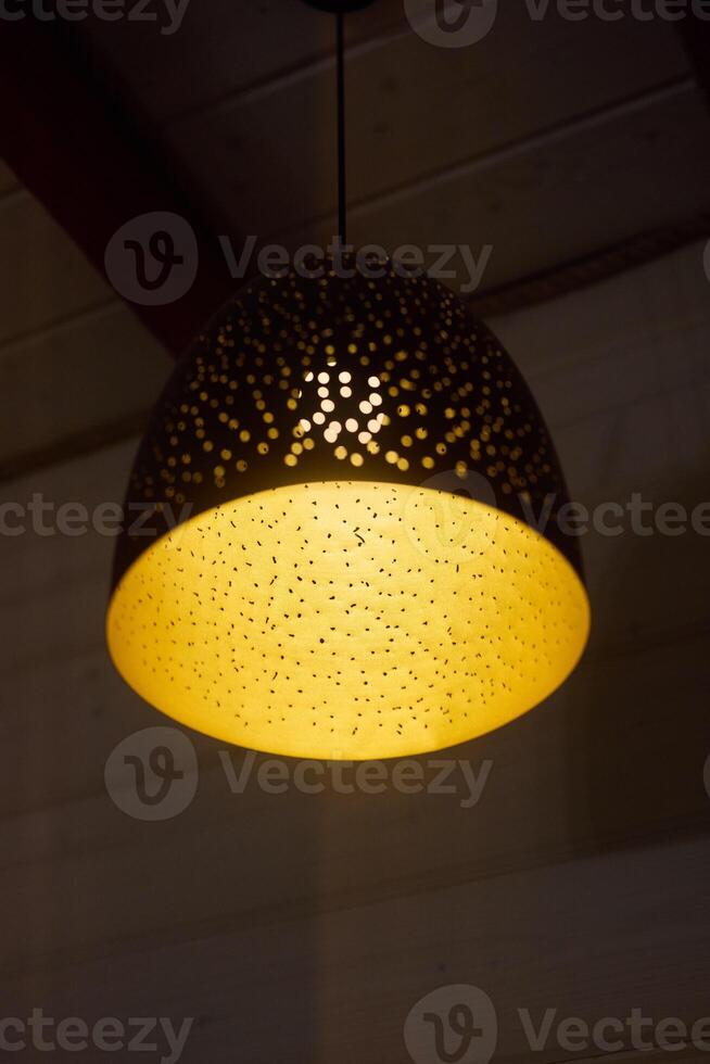 Stylish and Elegant Pendant Light Featuring a Decorative Pattern to Enhance Your Space photo