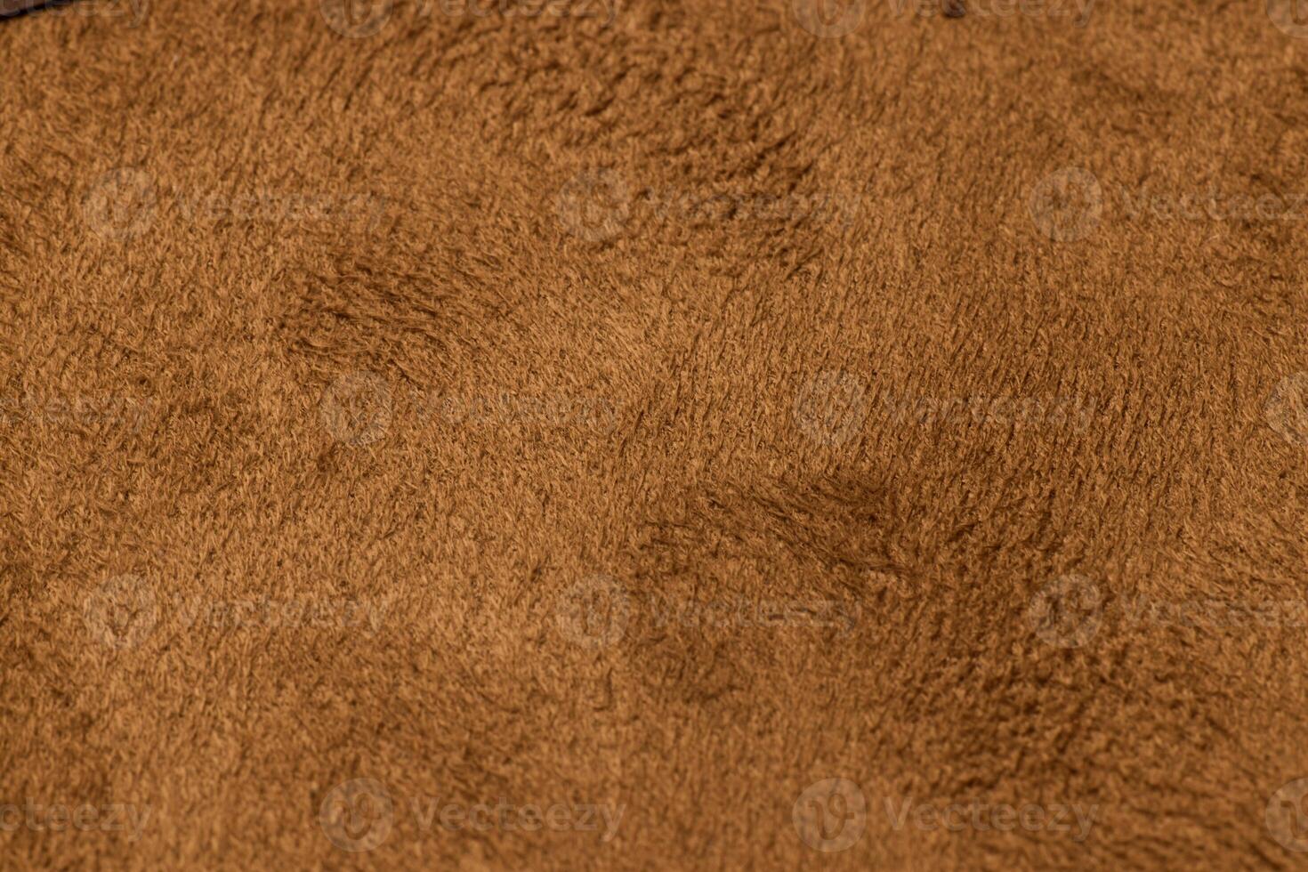 This luxurious Textured Suede Fabric comes in a rich Warm Brown Shade suitable for various uses photo