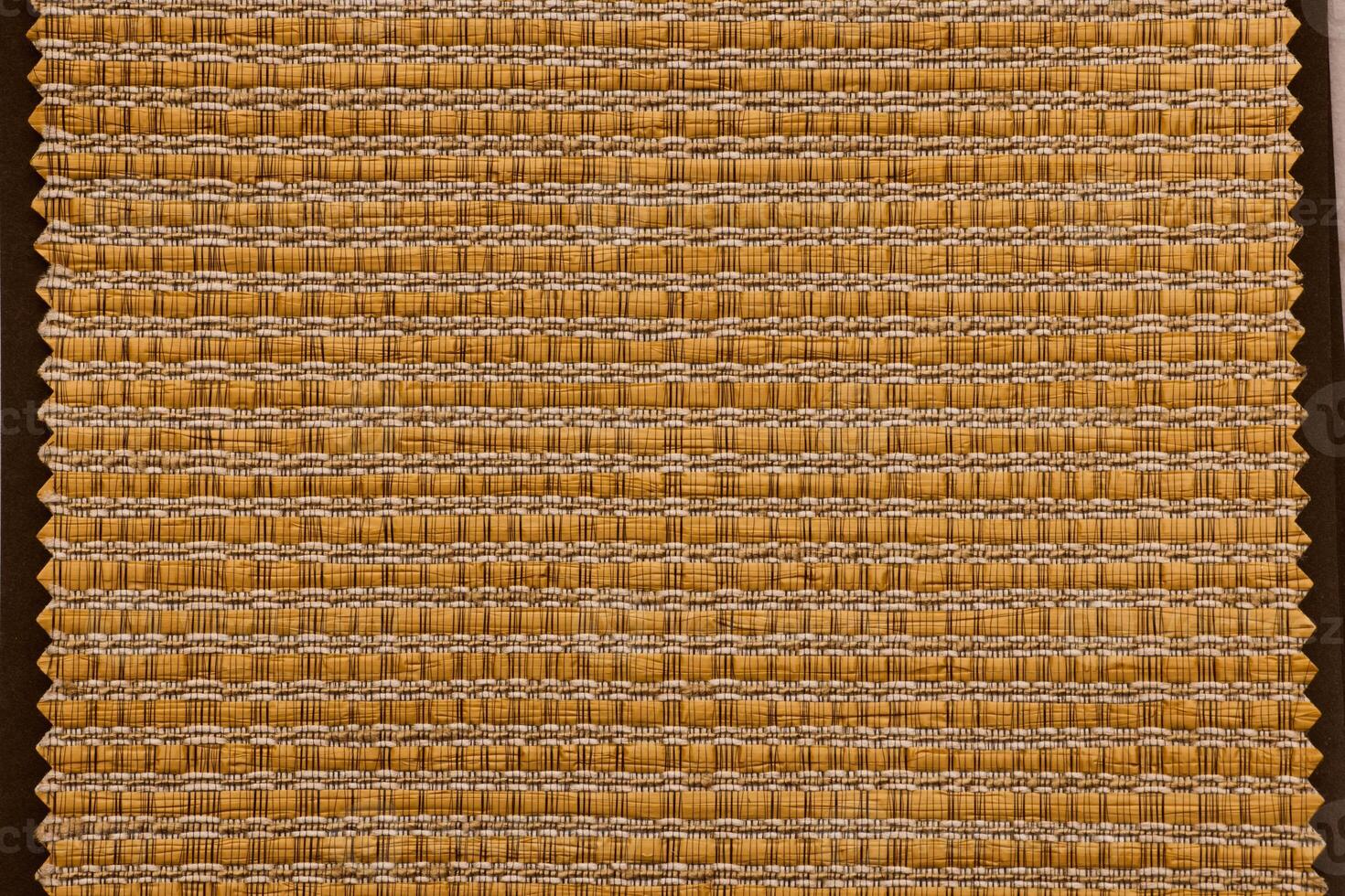 The beautifully textured weave pattern features warm earthy tones that create an inviting ambiance photo