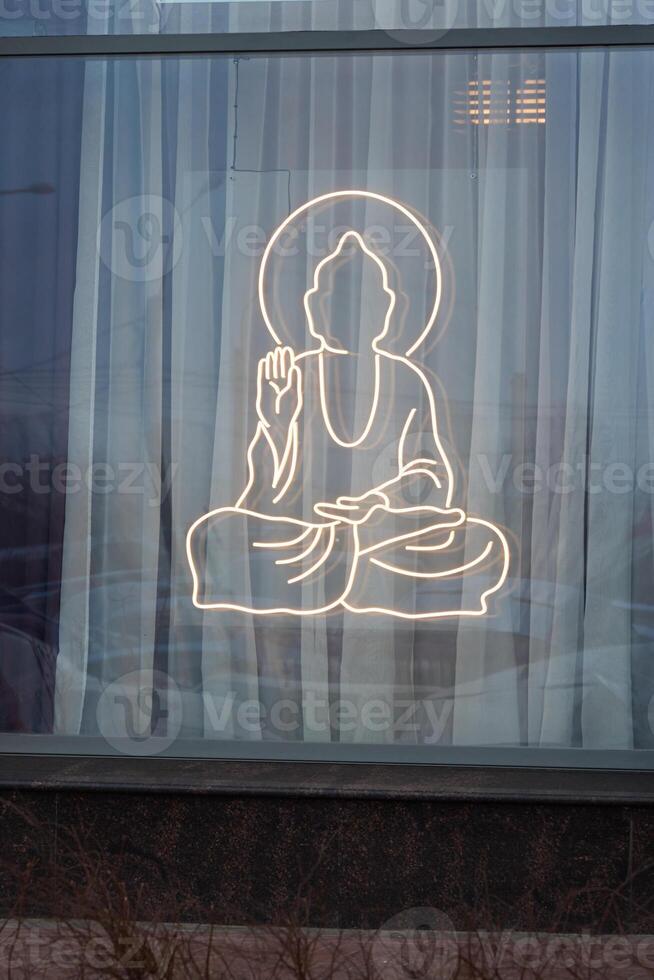 The Beautiful Buddha Neon Light Decoration is Tastefully Displayed Elegantly in the Window Area photo