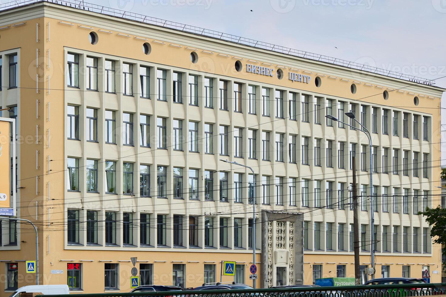 A Historic Building Featuring Classic Architecture Set in a Bustling Urban Environment photo