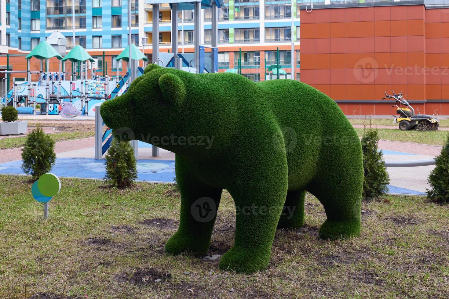 The Green Bear Sculpture located within the Urban Playground invites joy and creativity photo