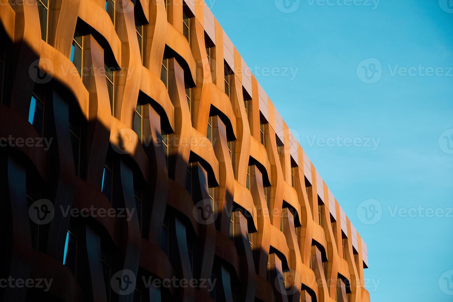 Modern architecture with a distinctive patterned facade enhances urban aesthetic appeal photo