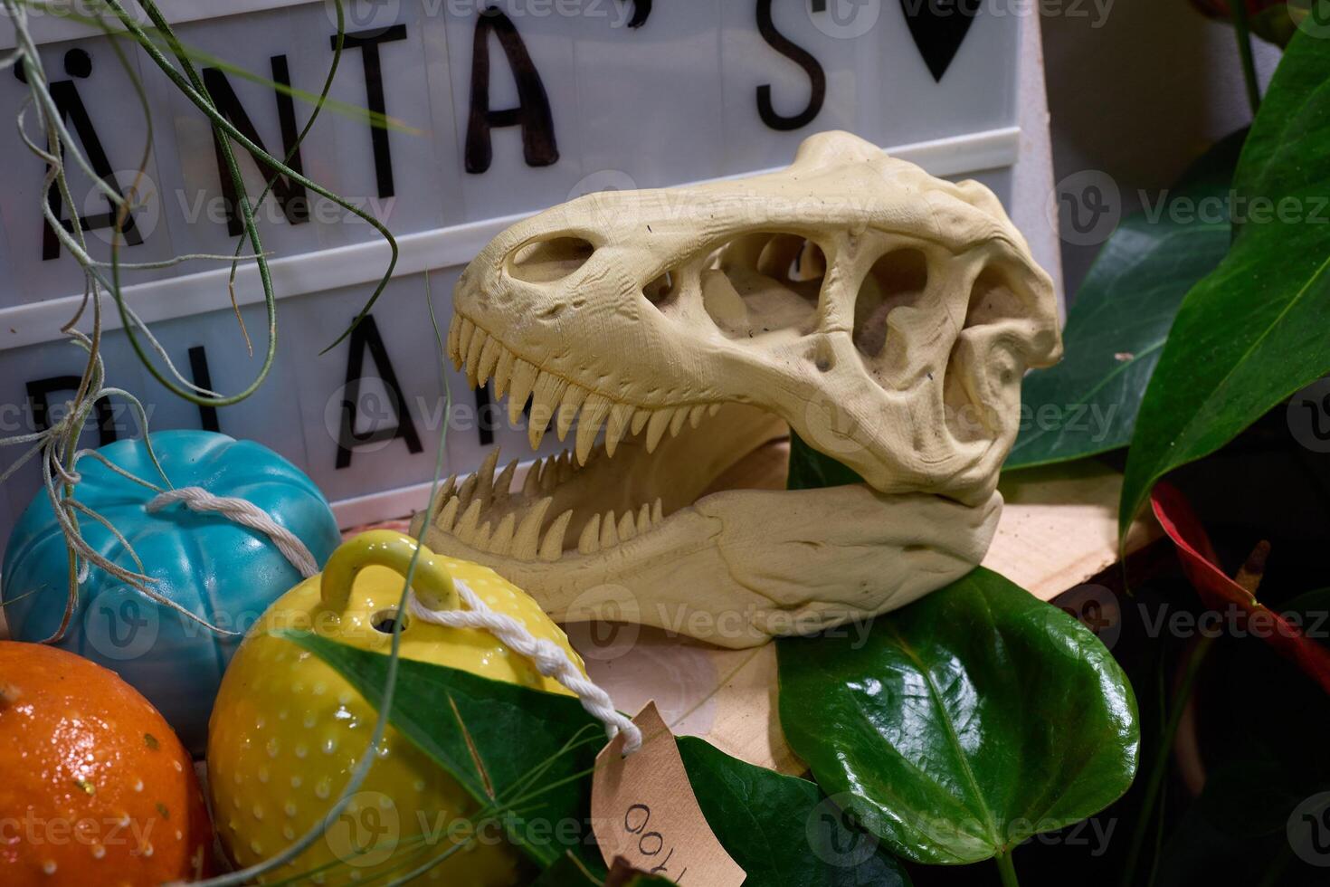 Dinosaur Skull Decoration with Brightly Colored Ornaments and Vibrant Plants for Display photo