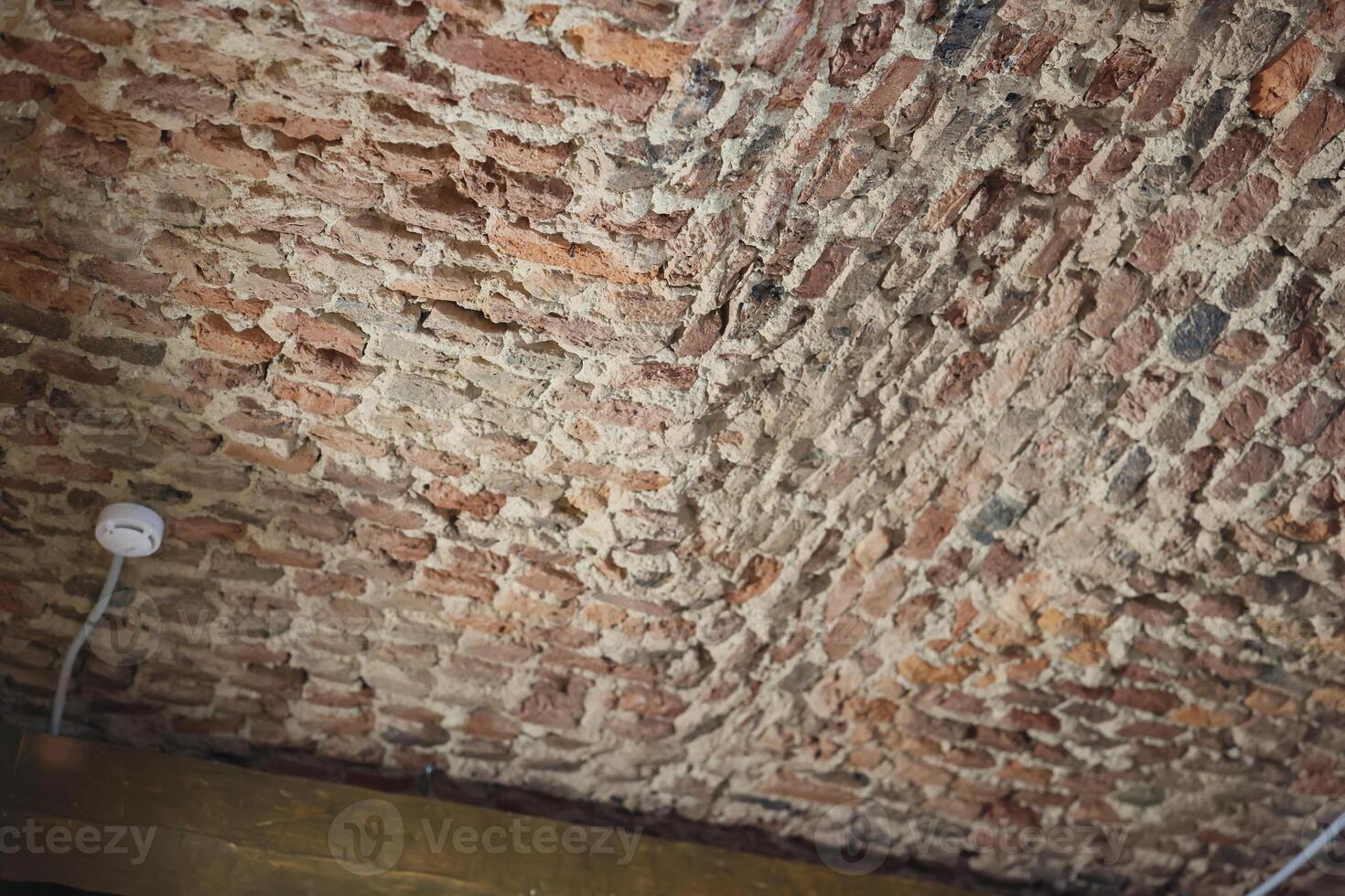 An enchanting Textured Brick Ceiling featuring a Rustic Charm that attracts attention photo