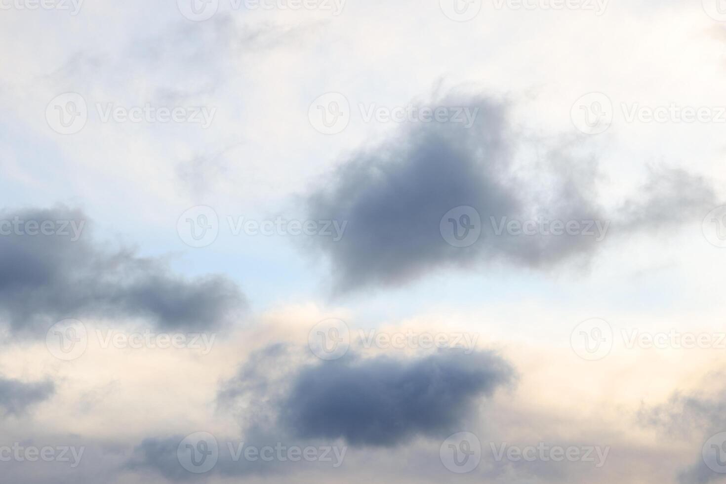 An exceptionally serene sky adorned with gentle clouds in delightful soft hues throughout photo