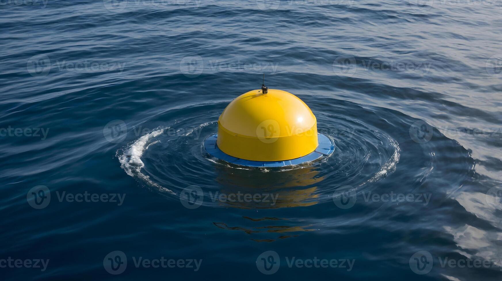 A yellow buoy floating in the ocean photo