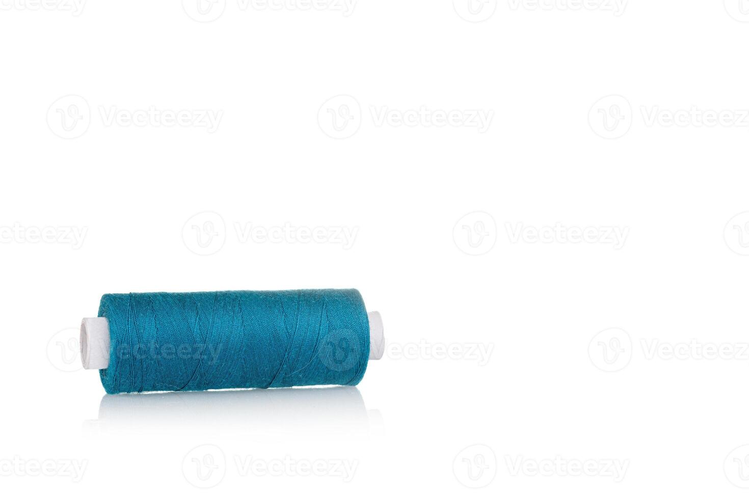 a skein of threads of blue color macro on a white background photo