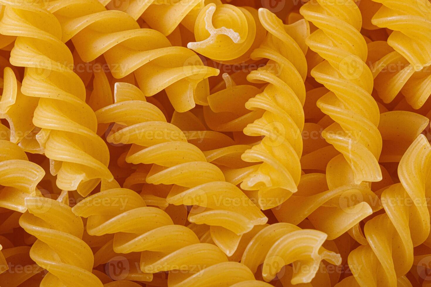 Pasta products in the form of a spiral, texture photo