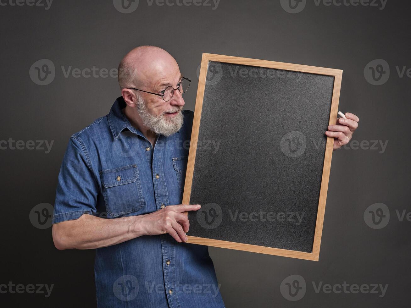 senior man, teacher, mentor or presenter, with blank blackboard, education, presentation and business communication concept photo