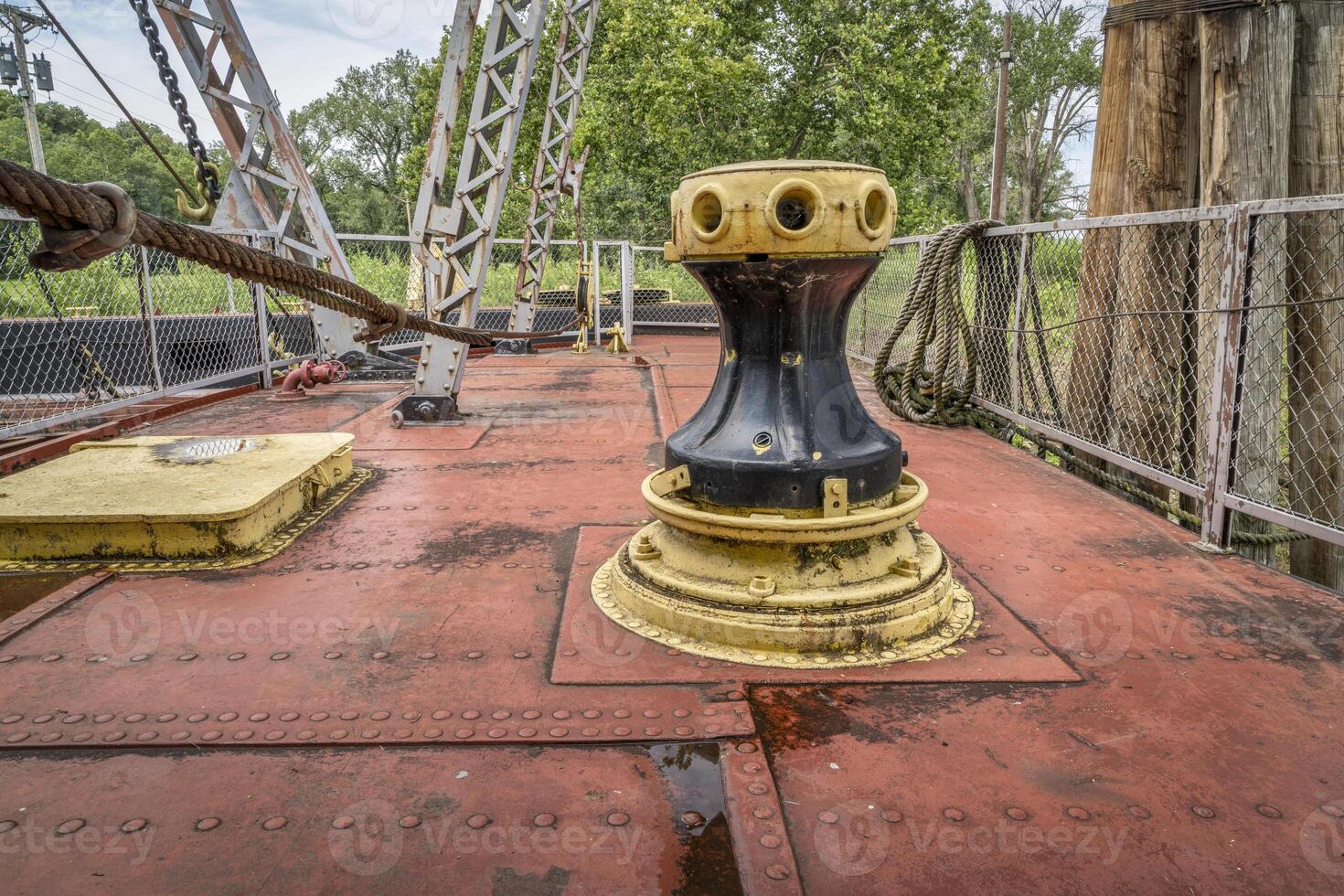 capstan and other gear on a deck of a vintage sidewheeler river dredge photo