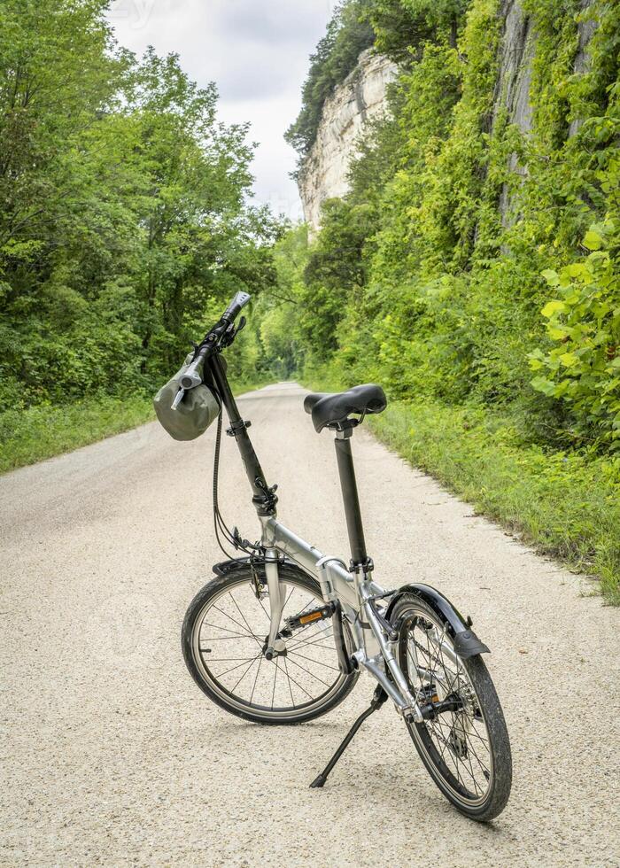 lightweight folding bike on Katy Trail near Rocheport, Missouri, summer scenery. The Katy Trail is 237 mile bike trail converted from an old railroad. photo