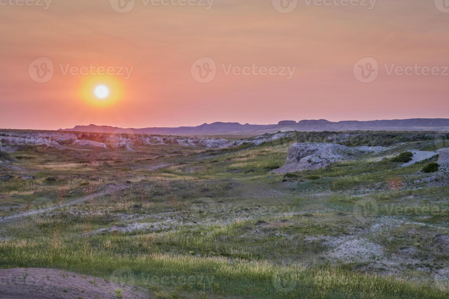 sunset over arroyo and prairie in Colorado photo