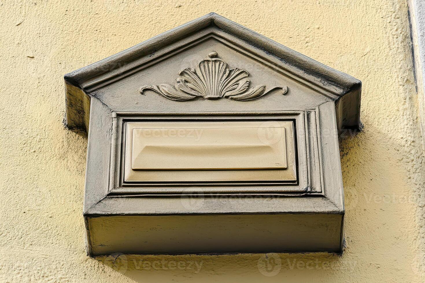 A mailbox on a wall photo