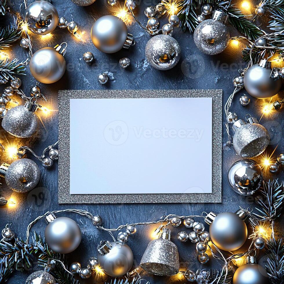 Blank Christmas card surrounded by silver glitter baubles festive and elegant photo