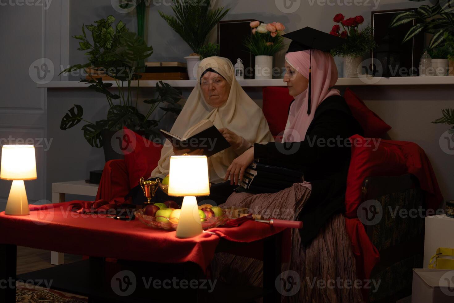 Two women sitting on a couch photo