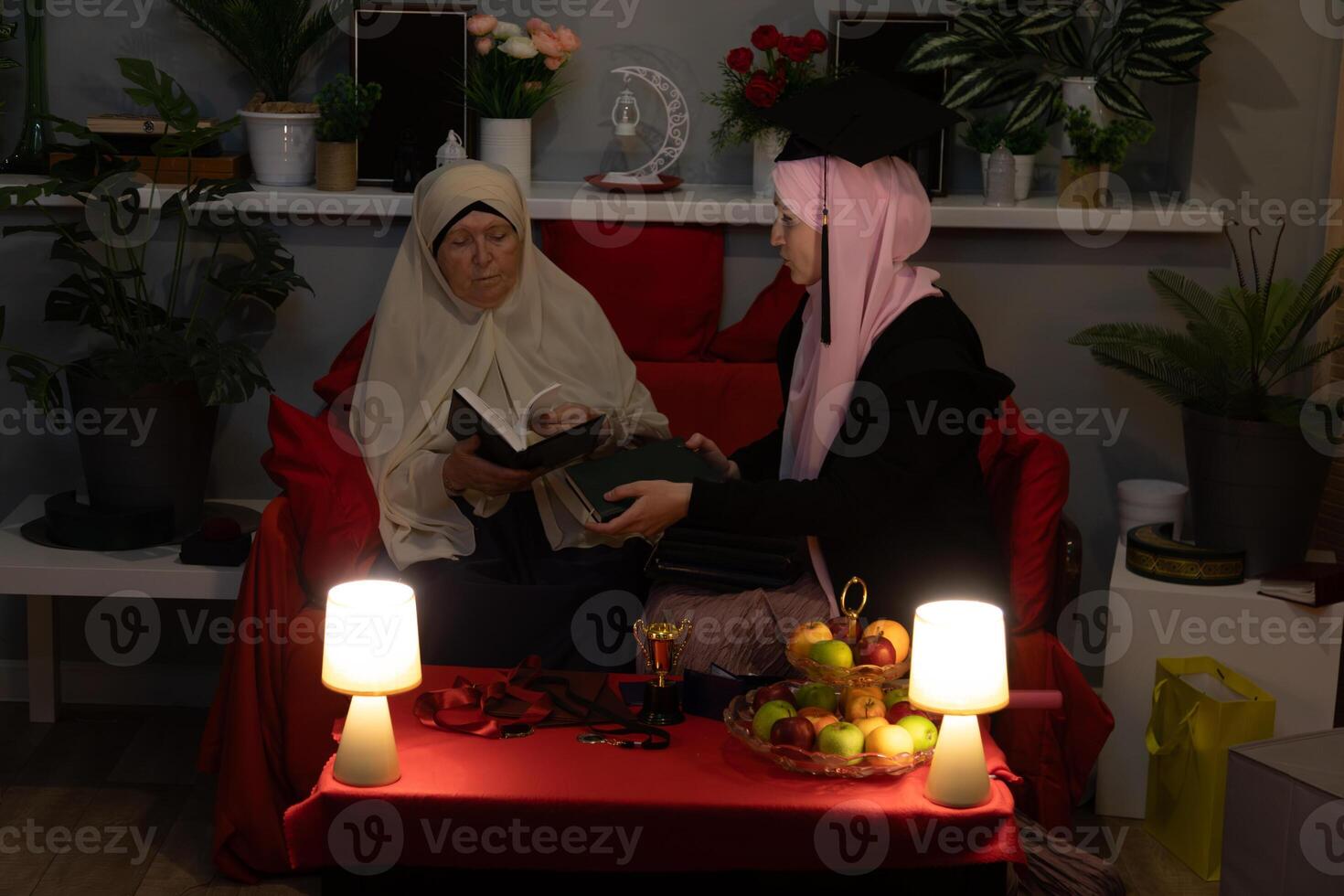 Two women sitting on a couch photo