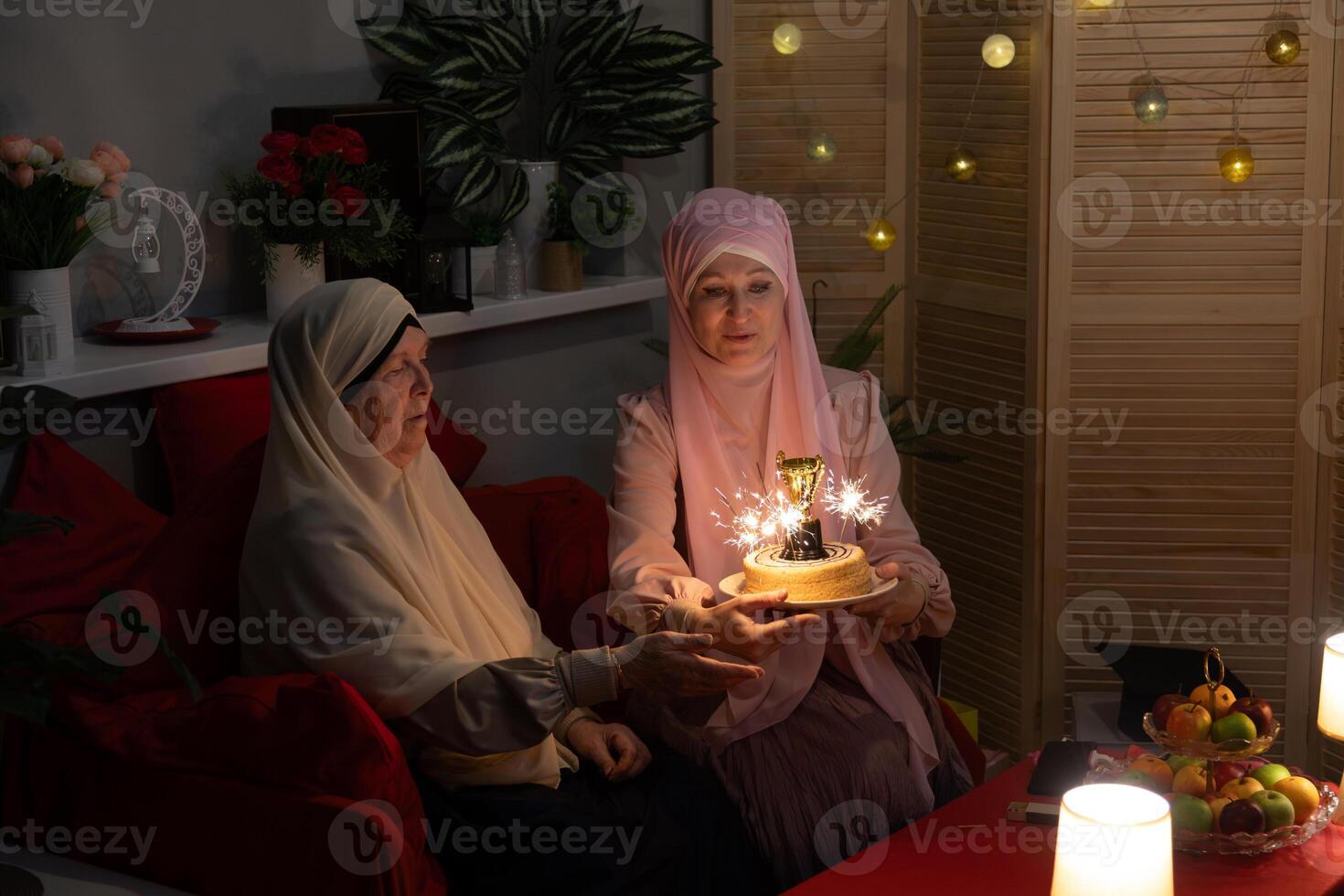 Two women sitting on a couch photo