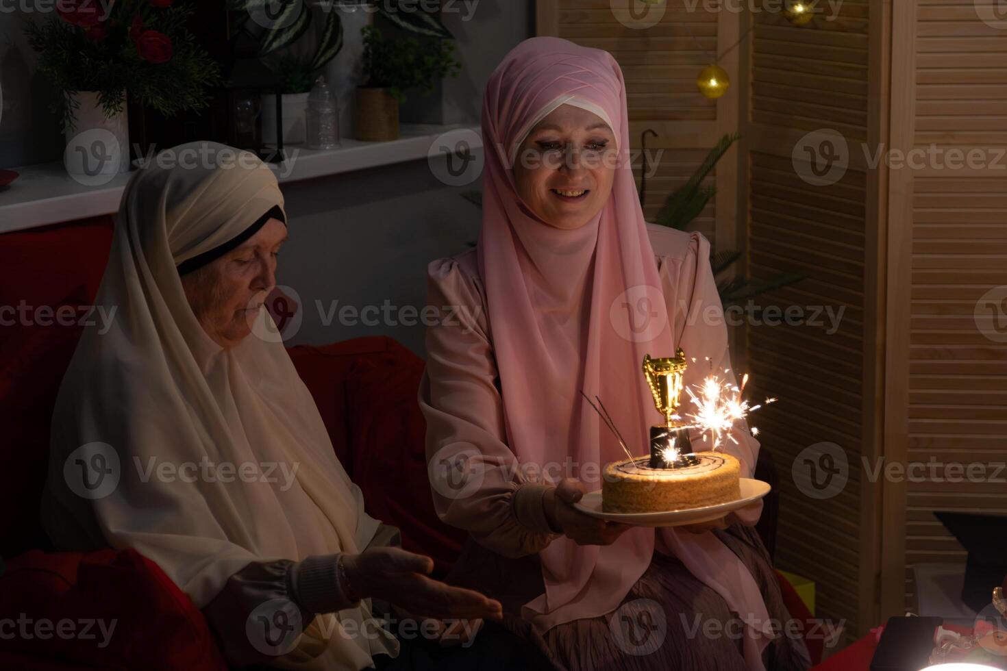 A woman wearing a pink headscarf photo